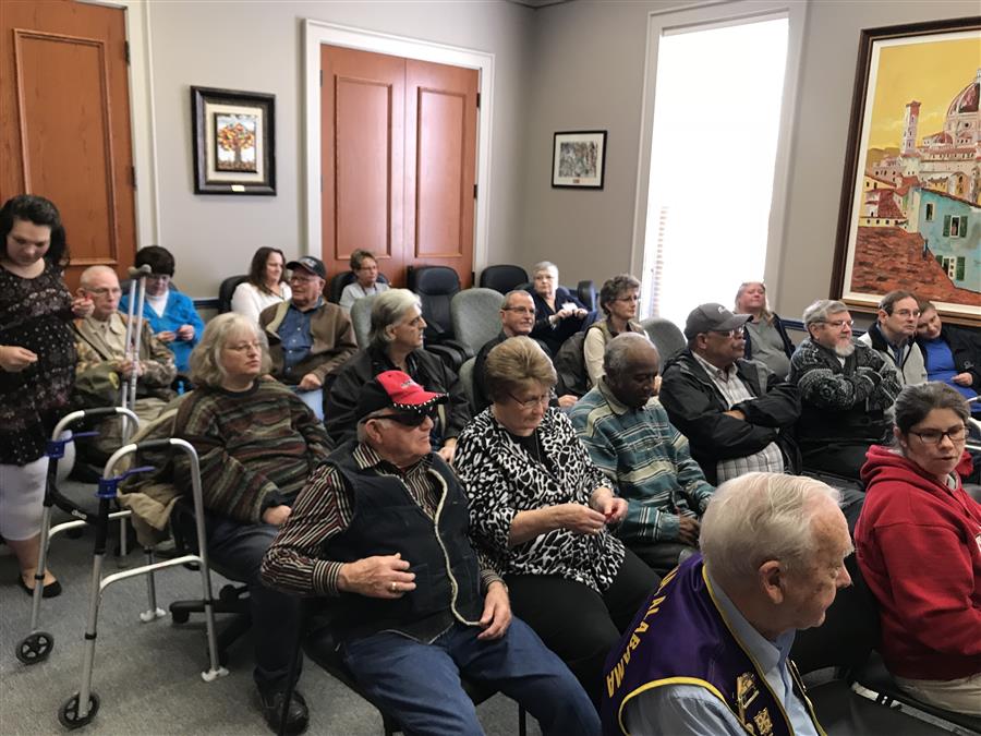 Consumers seated at a workshop.